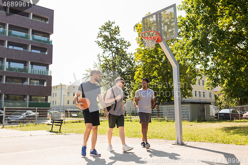 Image of group of male friends going to play basketball