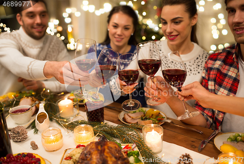 Image of close up of friends with wine celebrate christmas