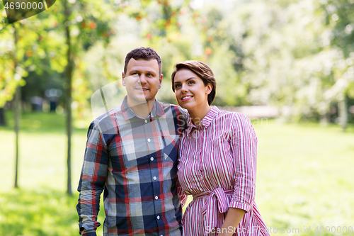 Image of happy couple in summer park