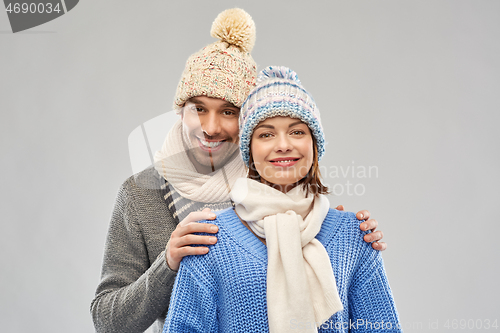 Image of happy couple in winter clothes