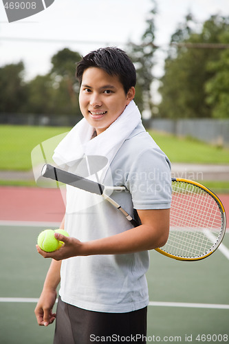 Image of Young asian tennis player