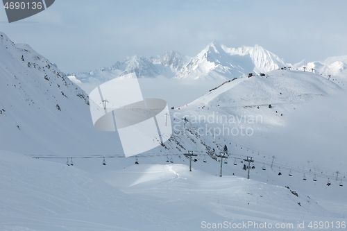 Image of Snowy skiing slopes from the top