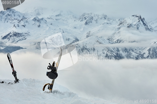 Image of Snowboard high up in the snowy Alps