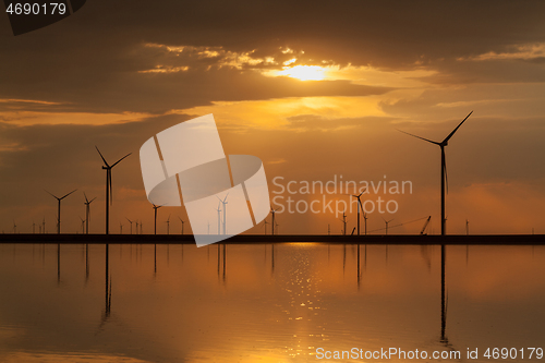 Image of Group of wind turbines on the coastline.