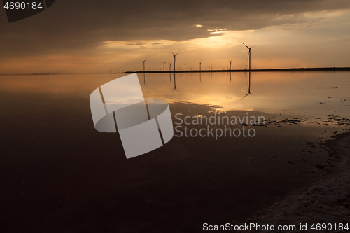 Image of Group of wind turbines on the coastline.