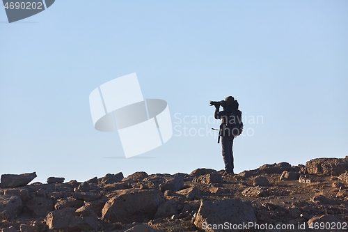 Image of Standing on a cliff