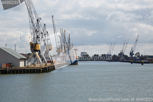 Image of Industrial ships in dock with rotterdam city view