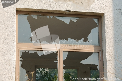 Image of Broken window of abandoned building