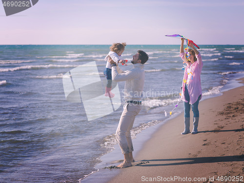 Image of happy family enjoying vecation during autumn day