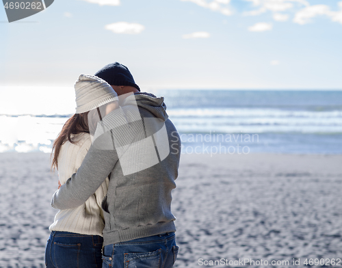 Image of Couple chating and having fun at beach bar