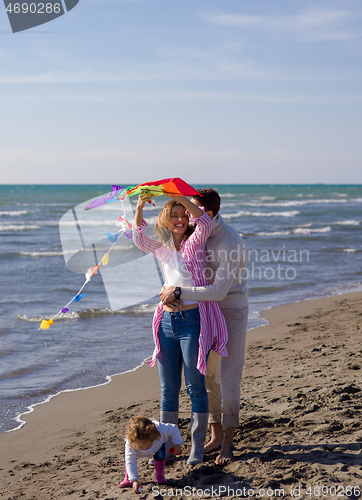 Image of happy family enjoying vecation during autumn day