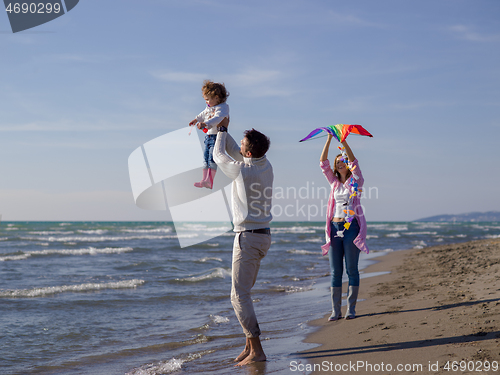 Image of happy family enjoying vecation during autumn day