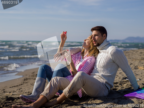Image of young couple enjoying time together at beach