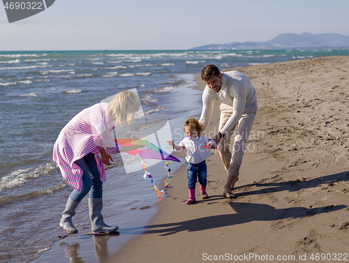 Image of happy family enjoying vecation during autumn day