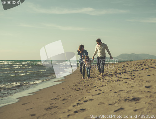 Image of Young family enjoying vecation during autumn day