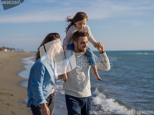 Image of Young family enjoying vecation during autumn day