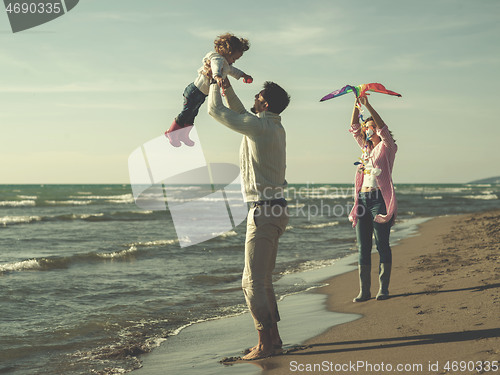 Image of happy family enjoying vecation during autumn day