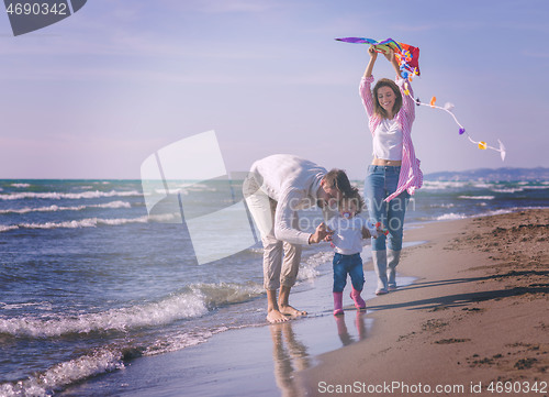 Image of happy family enjoying vecation during autumn day