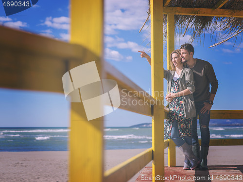 Image of Couple chating and having fun at beach bar