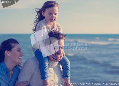 Image of Young family enjoying vecation during autumn day