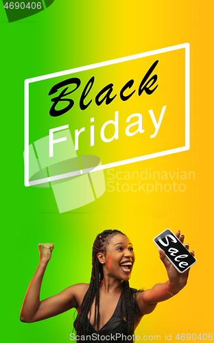 Image of Beautiful woman inviting for shopping in black friday, sales concept. Vertical flyer, gradient background
