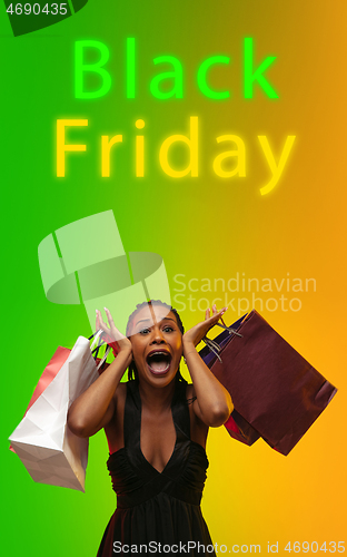 Image of Beautiful woman inviting for shopping in black friday, sales concept. Vertical flyer, gradient background