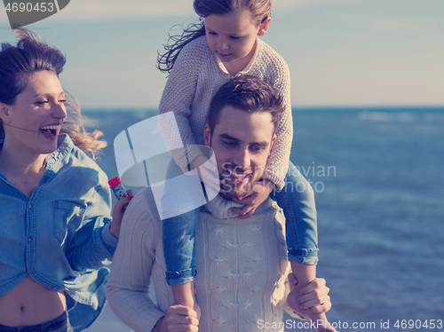 Image of Young family enjoying vecation during autumn day