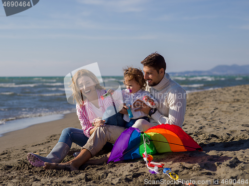 Image of Young family enjoying vecation during autumn day