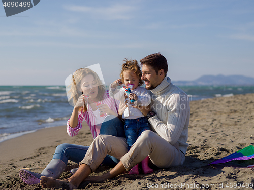 Image of Young family enjoying vecation during autumn day