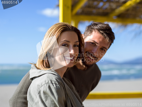 Image of Couple chating and having fun at beach bar