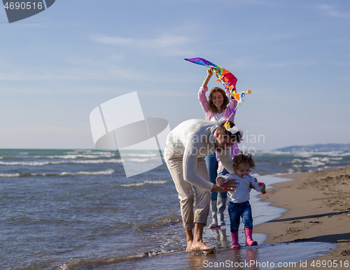 Image of happy family enjoying vecation during autumn day