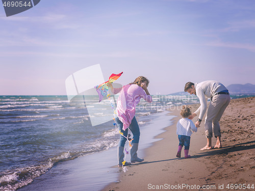 Image of happy family enjoying vecation during autumn day