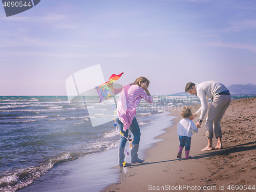 Image of happy family enjoying vecation during autumn day