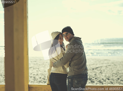 Image of Couple chating and having fun at beach bar