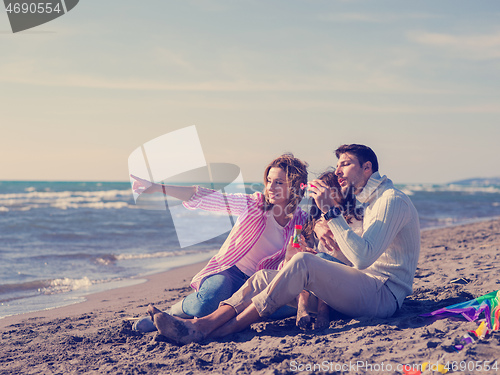 Image of Young family enjoying vecation during autumn day