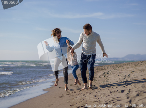 Image of Young family enjoying vecation during autumn day