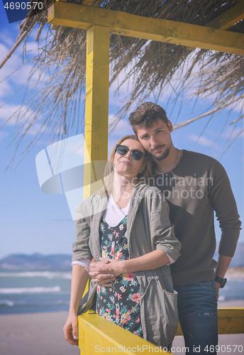 Image of Couple chating and having fun at beach bar