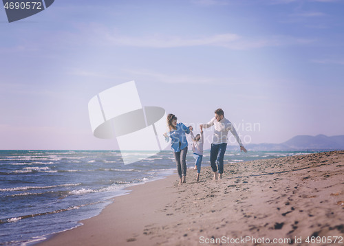 Image of Young family enjoying vecation during autumn day