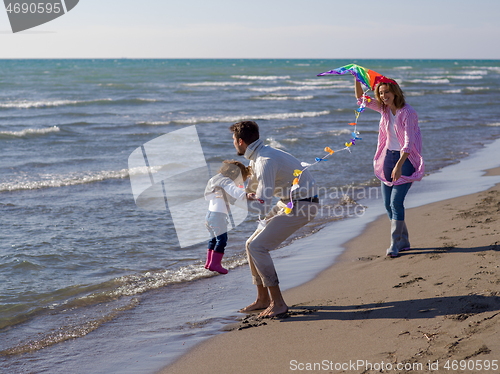 Image of happy family enjoying vecation during autumn day