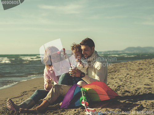 Image of Young family enjoying vecation during autumn day