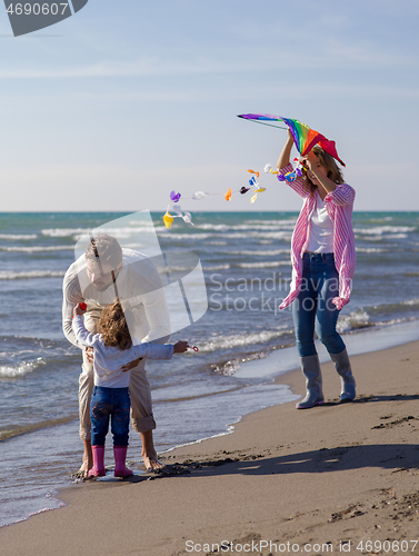 Image of happy family enjoying vecation during autumn day