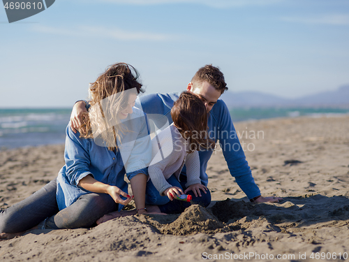 Image of Young family enjoying vecation during autumn day