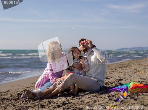 Image of Young family enjoying vecation during autumn day