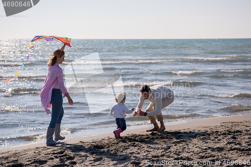 Image of happy family enjoying vecation during autumn day