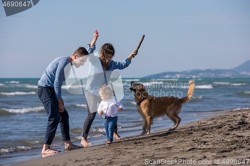 Image of happy young family enjoying vecation during autumn day