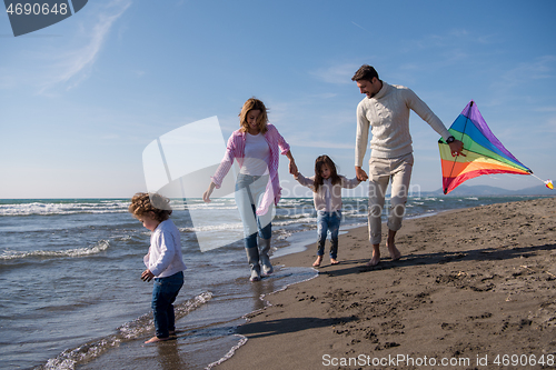 Image of happy family enjoying vecation during autumn day