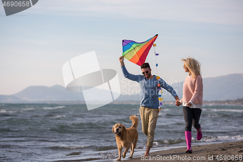 Image of happy couple enjoying time together at beach