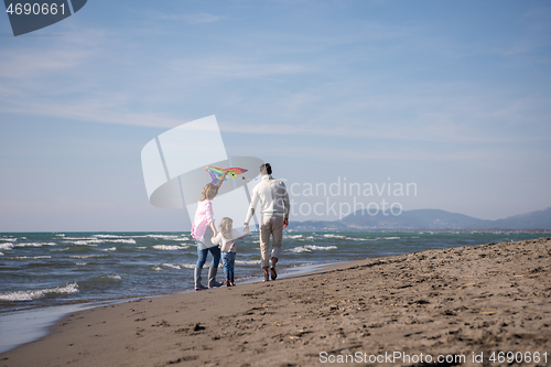 Image of happy family enjoying vecation during autumn day