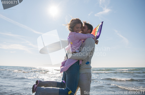 Image of Couple enjoying time together at beach