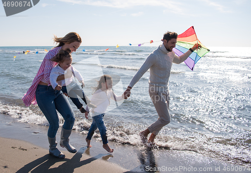 Image of happy family enjoying vecation during autumn day